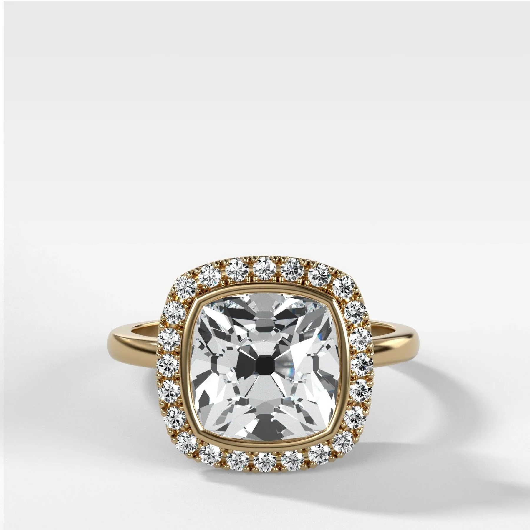 Bezel Set Halo Engagement Ring With Old Mine Cut Diamond