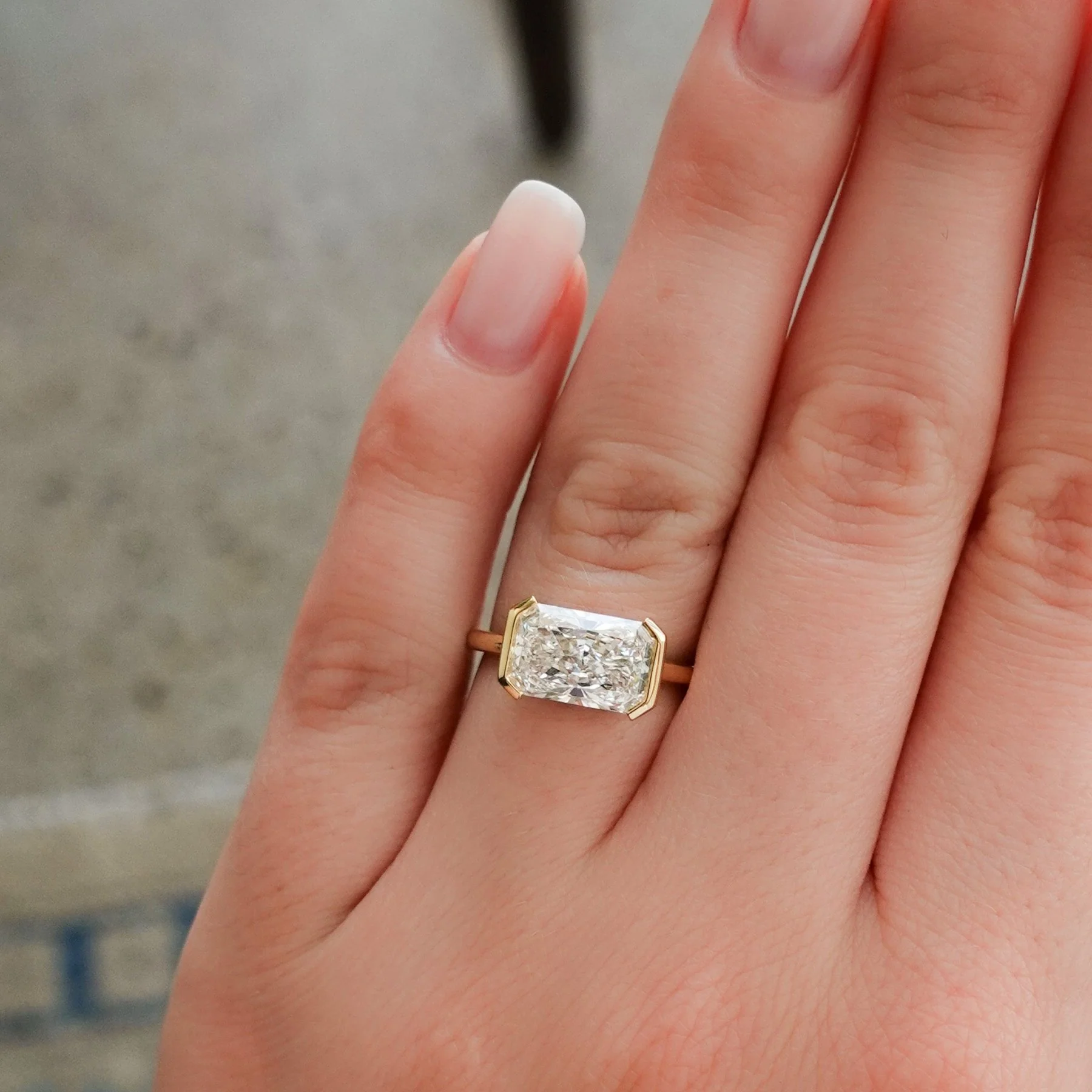 East West Half Bezel Solitaire Engagement Ring With 4.07ct Radiant Cut Lab Grown Diamond - Image 4