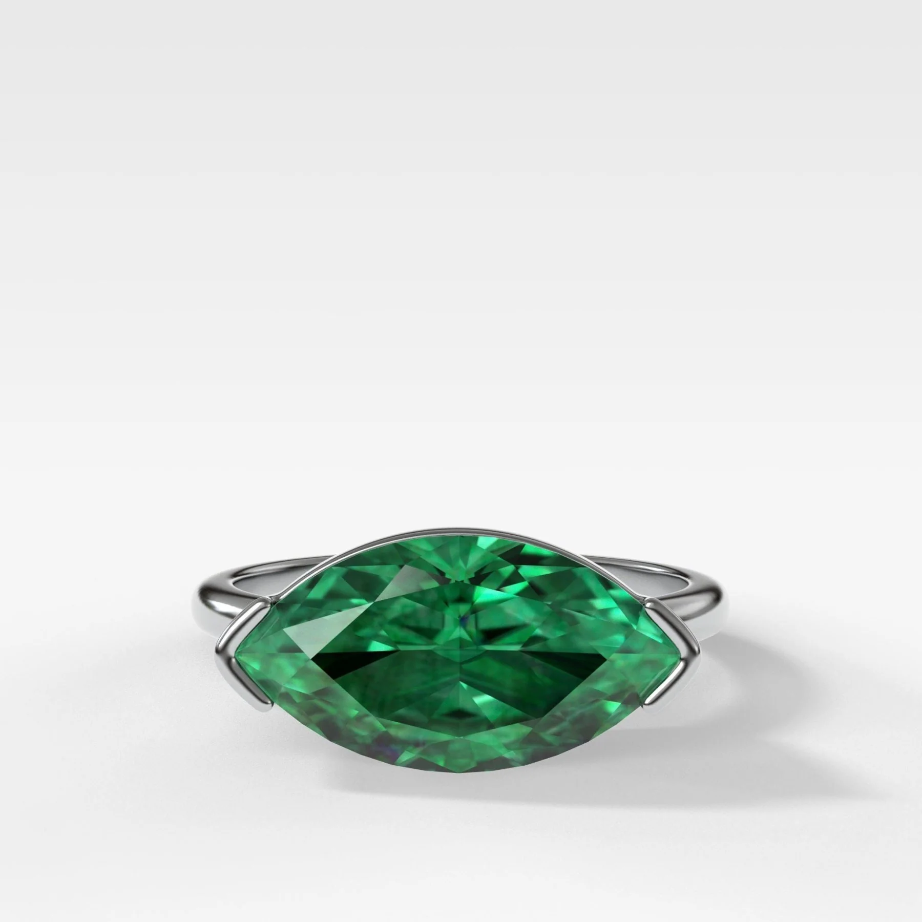 East West Half Bezel Solitaire Engagement Ring With Marquise Cut Green Emerald - Image 3