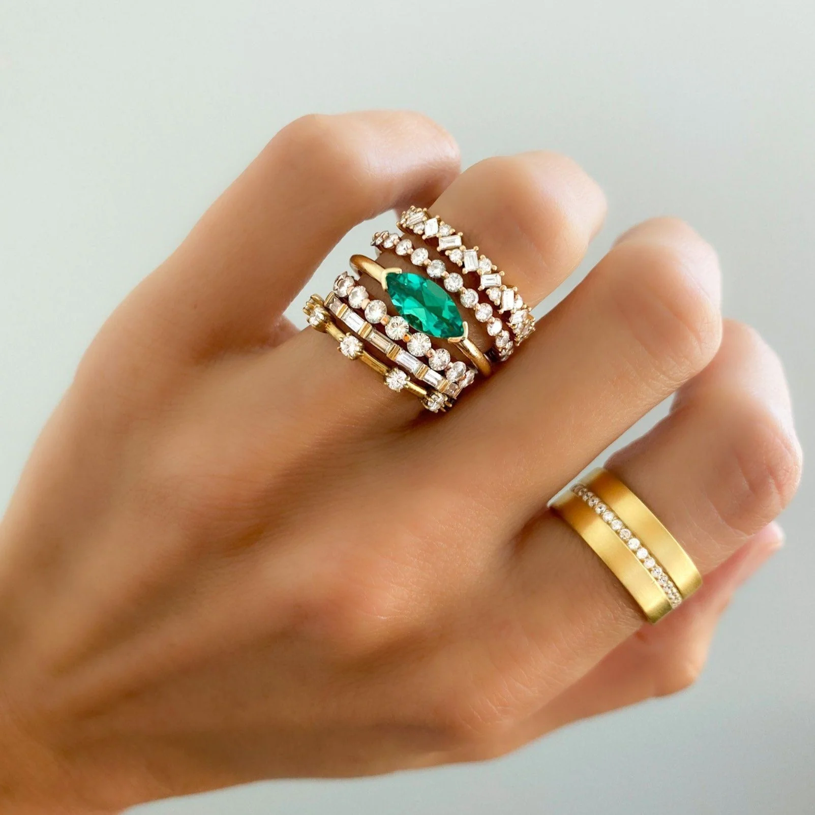 East West Half Bezel Solitaire Engagement Ring With Marquise Cut Green Emerald - Image 5