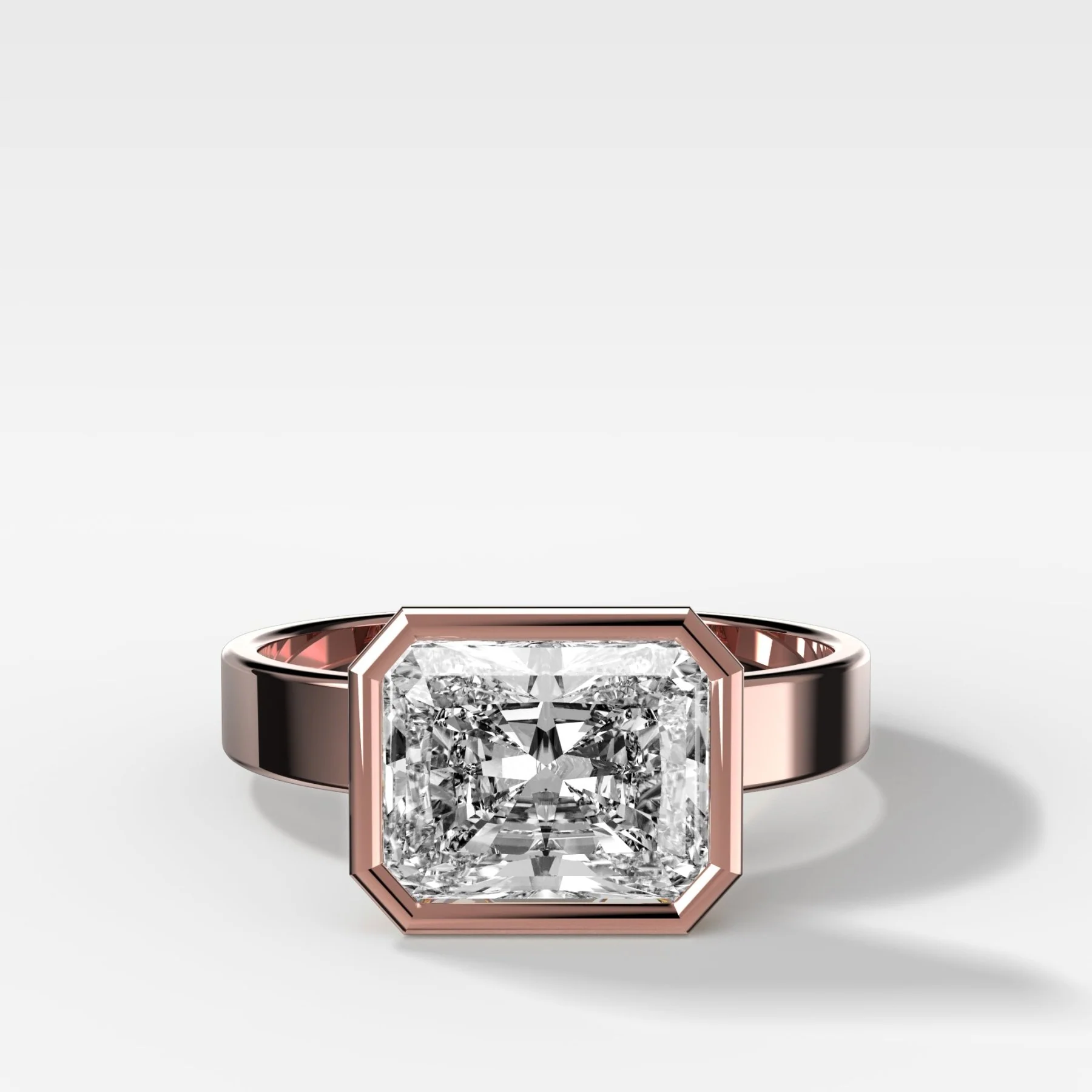 Finest Bezel Set Engagement Ring With East West Elongated Radiant Cut Diamond - Image 4