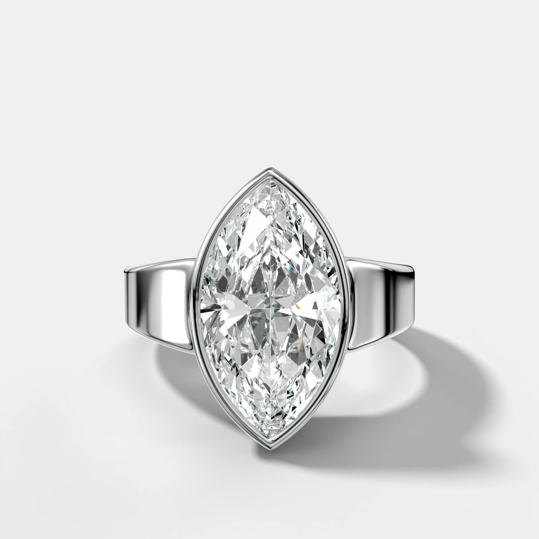 Finest Tapered Bezel Set Engagement Ring With Marquise Cut Diamond - Image 3