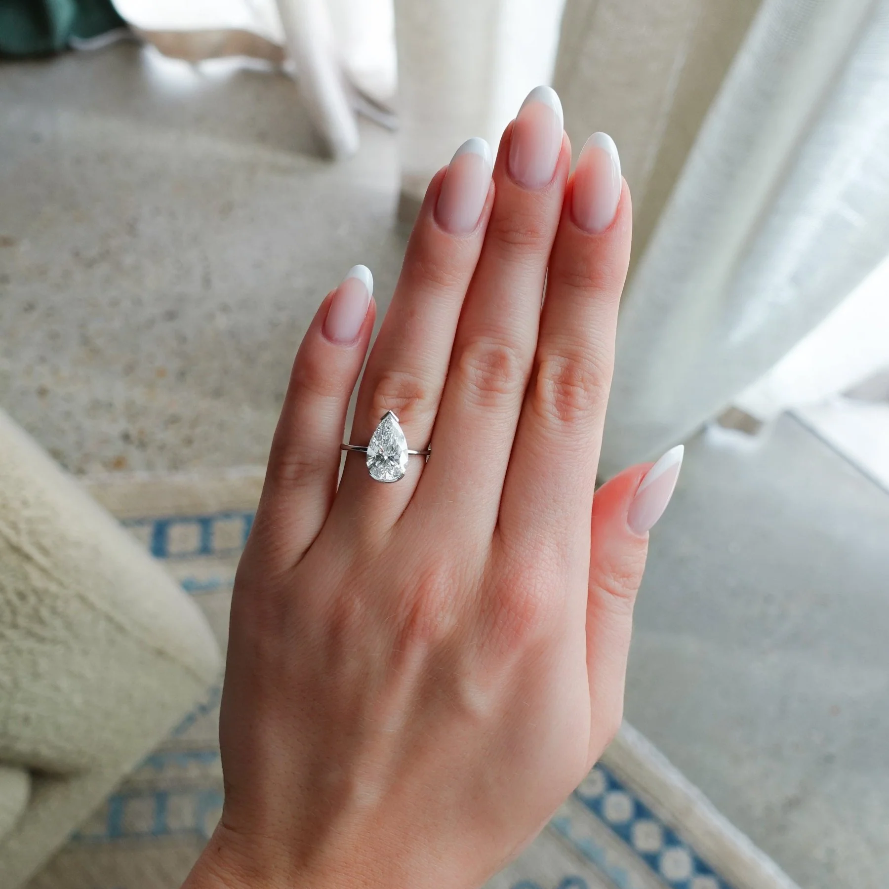 North South Half Bezel Solitaire Engagement Ring With Pear Cut Diamond - Image 3