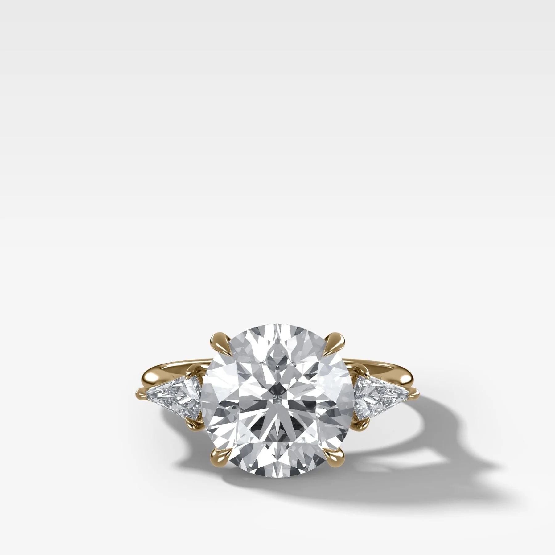 Three Stone Engagement Ring With Kite Side Stones and Round Cut Diamond